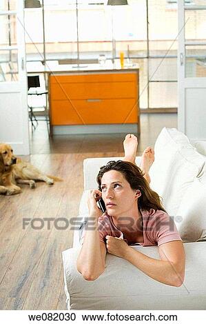 at-home, calling, brown hair, barefoot, apartment View Large Photo Image Stock Image - at-home, calling, brown hair, barefoot, apartment. Fotosearch