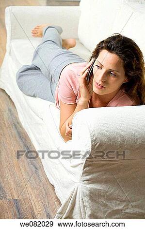 at-home, calling, brown hair, barefoot, apartment View Large Photo Image Stock Photo - at-home, calling, brown hair, barefoot, apartment. Fotosearch
