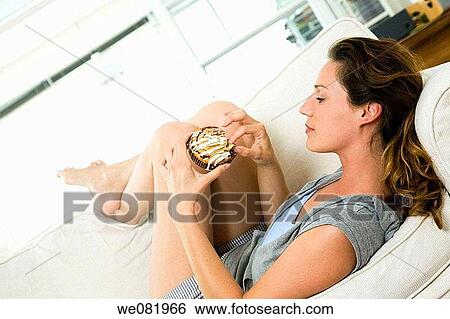 Stock Photograph - at-home, calorie, cake, barefoot, apartment. Fotosearch