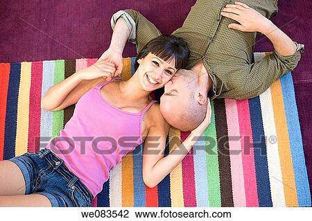 Stock Image - at-home, carpet, bonding, bond, affection. Fotosearch