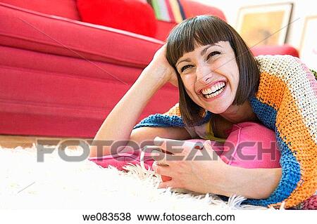 at-home, carpet, brunette, amusement View Large Photo Image Stock Photo - at-home, carpet, brunette, amusement. Fotosearch