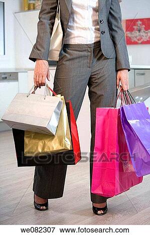 Stock Photo - at-home, carrying, carry, bag, addiction. Fotosearch