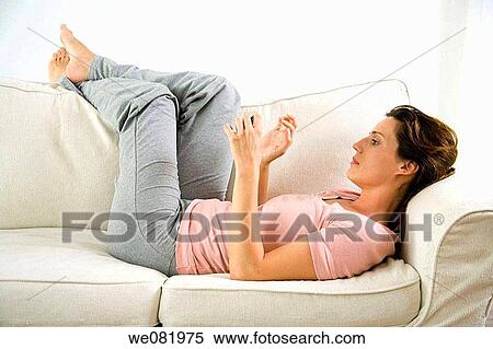at-home, cell phone, barefoot, apartment View Large Photo Image Stock Photography - at-home, cell phone, barefoot, apartment. Fotosearch