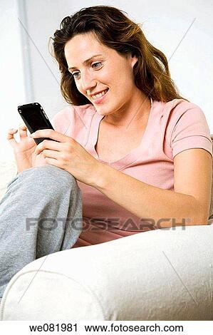 at-home, cell phone, brown hair, addiction View Large Photo Image Stock Image - at-home, cell phone, brown hair, addiction. Fotosearch