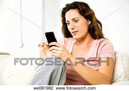 at-home, cell phone, brown hair, addiction View Large Photo Image Stock Image - at-home, cell phone, brown hair, addiction. Fotosearch