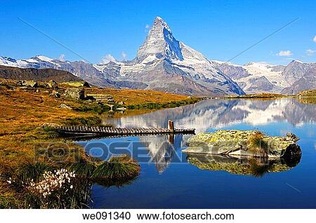At lake Stellisee near Zermatt, Mt Matterhorn in the background, Zermatt, Valais Switzerland View Large Photo Image Stock Image - At lake Stellisee near Zermatt, Mt Matterhorn in the background, Zermatt, Valais Switzerland. Fotosearch