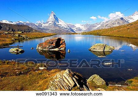 At lake Stellisee near Zermatt, Mt Matterhorn in the background, Zermatt, Valais Switzerland View Large Photo Image Stock Image - At lake Stellisee near Zermatt, Mt Matterhorn in the background, Zermatt, Valais Switzerland. Fotosearch