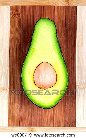 Avocado Pear cut in half View Large Photo Image Stock Photo - Avocado Pear cut in half. Fotosearch