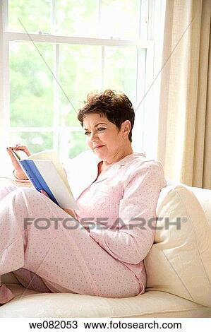 baby boomer, calm, brunette, book, at-home View Large Photo Image Stock Image - baby boomer, calm, brunette, book, at-home. Fotosearch