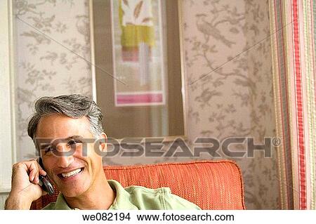 baby boomer, cell phone, calling, at-home View Large Photo Image Picture - baby boomer, cell phone, calling, at-home. Fotosearch