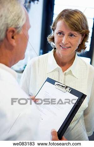 Stock Image - baby boomer, conversation, Attache case. Fotosearch