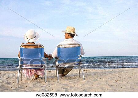 Stock Photo - back view, beach, calm, chair. Fotosearch