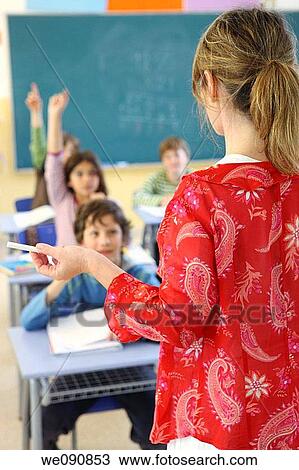 back view, boy, board, blackboard, Arm raised View Large Photo Image Stock Image - back view, boy, board, blackboard, Arm raised. Fotosearch