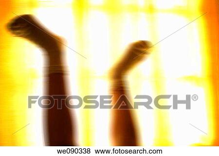 Stock Photo - backlight, blurred, concept, contemporary, feet. Fotosearch