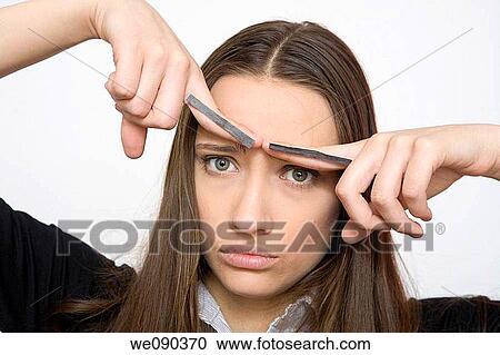 Stock Image - Bad mood, blue eyes, bewilderment, bewildered, angry. Fotosearch