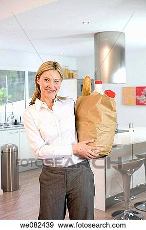 bag, carrying, carry, blond, at-home View Large Photo Image Stock Photo - bag, carrying, carry, blond, at-home. Fotosearch