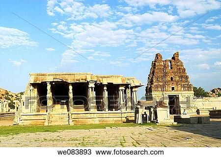 Bajan Mandap and Shri Vijayavitthala Temple tower in Hampi, Karnataka. The construction of this temple started during the reign of King Krishna Deva Raya in the year 1513 AD. The project was so colossal that the additions continued for almost five decades View Large Photo Image Stock Image - Bajan Mandap and Shri Vijayavitthala Temple tower in Hampi, Karnataka. The construction of this temple started during the reign of King Krishna Deva Raya in the year 1513 AD. The project was so colossal that the additions continued for almost five decades. Fotosearch