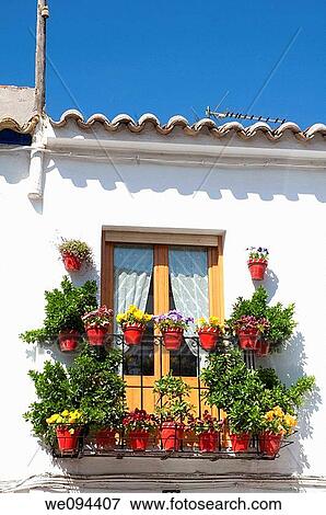 Balcony with flowerpots. Tembleque, Toledo province, Castilla La Mancha, Spain. View Large Photo Image Stock Photo - Balcony with flowerpots. Tembleque, Toledo province, Castilla La Mancha, Spain.. Fotosearch