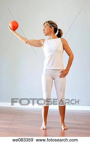 Stock Photo - ball, barefoot, contemporary. Fotosearch