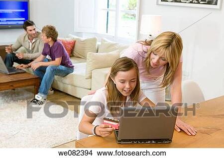 Picture - Bank card, boy, at-home. Fotosearch