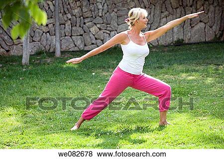 Stock Photo - barefoot, blond, Arms open. Fotosearch
