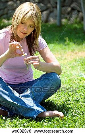 Stock Photo - barefoot, blond, calm. Fotosearch