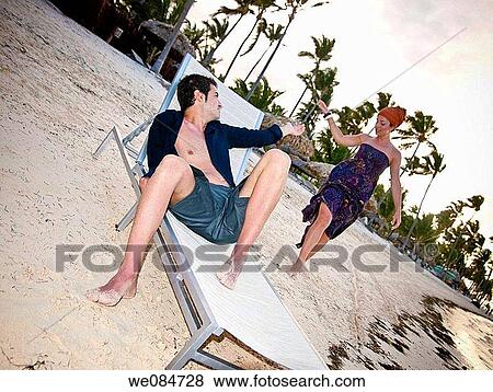 barefoot, calm, beach chair, beach, Arms raised View Large Photo Image Stock Photo - barefoot, calm, beach chair, beach, Arms raised. Fotosearch