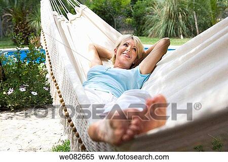 Stock Photography - barefoot, calm, blond, absorbed. Fotosearch