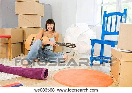 barefoot, cardboard, brunette, at-home View Large Photo Image Stock Photo - barefoot, cardboard, brunette, at-home. Fotosearch