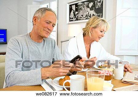 bathrobe, cell phone, breakfast, at-home View Large Photo Image Stock Photo - bathrobe, cell phone, breakfast, at-home. Fotosearch