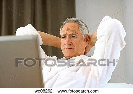 Stock Image - bathrobe, computer, contemporary. Fotosearch