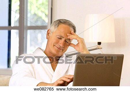 Stock Photography - bathrobe, computer, contemporary. Fotosearch