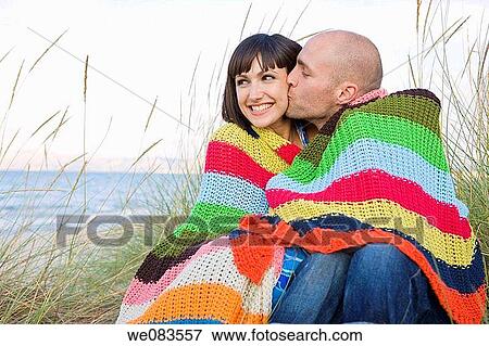 Stock Photo - beach, bonding, bond, blanket, affection. Fotosearch