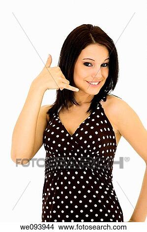 Beatiful Caucasian woman using her fingers to display the call me gesture View Large Photo Image Picture - Beatiful Caucasian woman using her fingers to display the call me gesture. Fotosearch