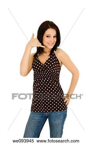 Beatiful Caucasian woman using her fingers to display the call me gesture View Large Photo Image Stock Photography - Beatiful Caucasian woman using her fingers to display the call me gesture. Fotosearch