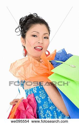 Beautiful and sexy Asian woman carrying shopping bags View Large Photo Image Picture - Beautiful and sexy Asian woman carrying shopping bags. Fotosearch