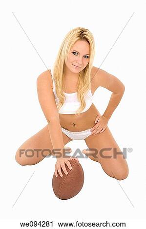 Beautiful and sexy Caucasian female posing with a football on white background View Large Photo Image Stock Image - Beautiful and sexy Caucasian female posing with a football on white background. Fotosearch