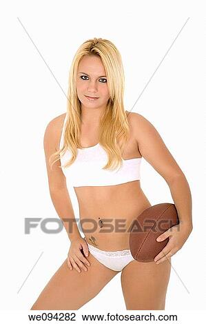 Beautiful and sexy Caucasian female posing with a football on white background View Large Photo Image Stock Image - Beautiful and sexy Caucasian female posing with a football on white background. Fotosearch