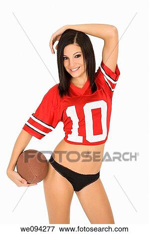 Beautiful and sexy Caucasian female posing with a football on white background View Large Photo Image Stock Photo - Beautiful and sexy Caucasian female posing with a football on white background. Fotosearch