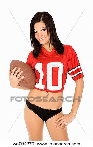 Beautiful and sexy Caucasian female posing with a football on white background View Large Photo Image Stock Photo - Beautiful and sexy Caucasian female posing with a football on white background. Fotosearch