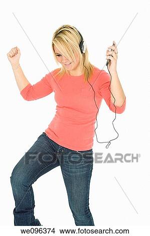 Beautiful and sexy caucasian girl listening to music View Large Photo Image Picture - Beautiful and sexy caucasian girl listening to music. Fotosearch