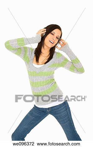 Beautiful and sexy caucasian girl listening to music View Large Photo Image Stock Image - Beautiful and sexy caucasian girl listening to music. Fotosearch