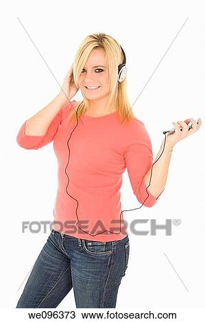 Beautiful and sexy caucasian girl listening to music View Large Photo Image Stock Image - Beautiful and sexy caucasian girl listening to music. Fotosearch