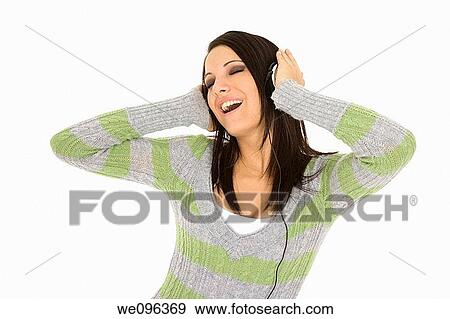 Beautiful and sexy caucasian girl listening to music View Large Photo Image Stock Photo - Beautiful and sexy caucasian girl listening to music. Fotosearch