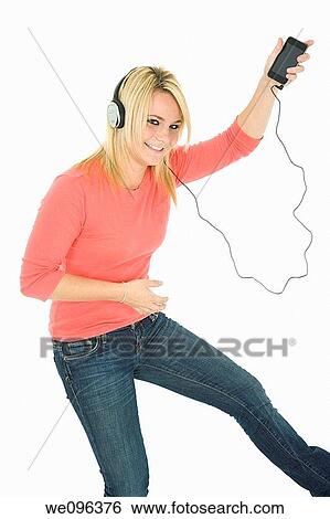 Beautiful and sexy caucasian girl listening to music View Large Photo Image Stock Photograph - Beautiful and sexy caucasian girl listening to music. Fotosearch