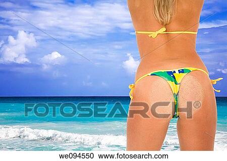 Beautiful and sexy caucasian woman in her early 20s posing in a Brazilian thong bikini with the turquoise waters and white sand beaches of Rio de Janeiro Brazil View Large Photo Image Stock Image - Beautiful and sexy caucasian woman in her early 20s posing in a Brazilian thong bikini with the turquoise waters and white sand beaches of Rio de Janeiro Brazil. Fotosearch