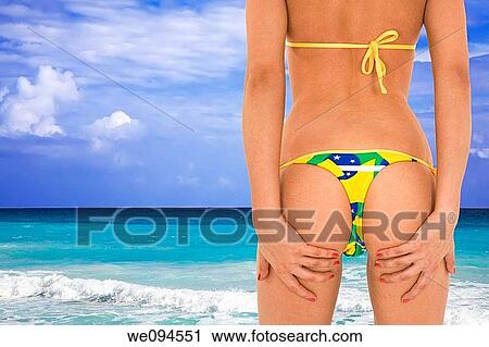 Beautiful and sexy caucasian woman in her early 20s posing in a Brazilian thong bikini with the turquoise waters and white sand beaches of Rio de Janeiro Brazil View Large Photo Image Stock Image - Beautiful and sexy caucasian woman in her early 20s posing in a Brazilian thong bikini with the turquoise waters and white sand beaches of Rio de Janeiro Brazil. Fotosearch