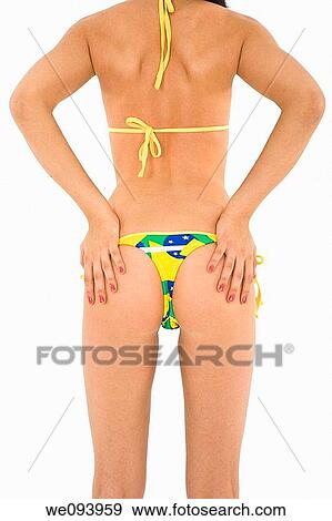Beautiful and sexy caucasian woman in her early 20s posing in a Brazilian thong bikini on a white background View Large Photo Image Stock Photo - Beautiful and sexy caucasian woman in her early 20s posing in a Brazilian thong bikini on a white background. Fotosearch