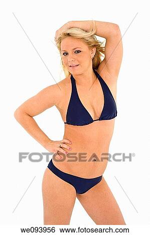 Beautiful and sexy caucasian woman in her early 20s posing in a navy bikini on a white background View Large Photo Image Stock Photograph - Beautiful and sexy caucasian woman in her early 20s posing in a navy bikini on a white background. Fotosearch