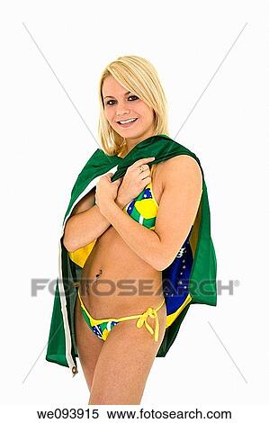 Beautiful and sexy caucasian woman in her early 20s posing in a Brazilian thong bikini and holding a Brazilian flag on a white background View Large Photo Image Stock Photography - Beautiful and sexy caucasian woman in her early 20s posing in a Brazilian thong bikini and holding a Brazilian flag on a white background. Fotosearch